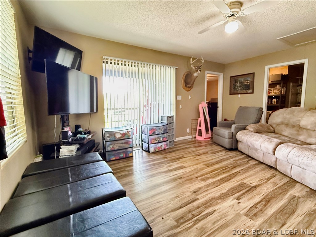 31137 Highland Road Rocky Mount, MO 65072 - Photo 12 of 23 Living Room with sliding door to access deck with