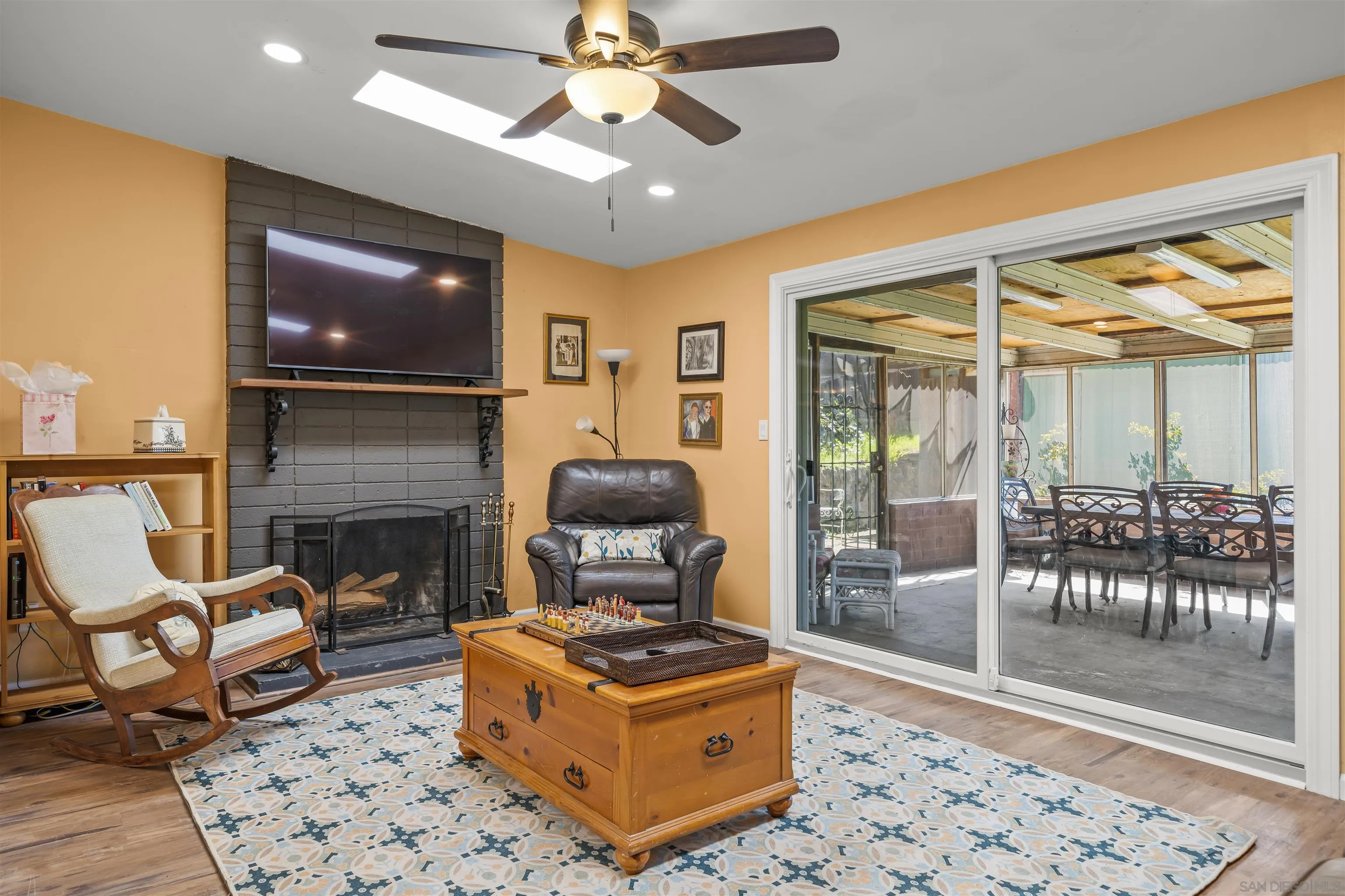 9240 Northcote Road Santee, CA 92071 - Photo 11 of 45 a living room with furniture a flat screen tv and a fireplace