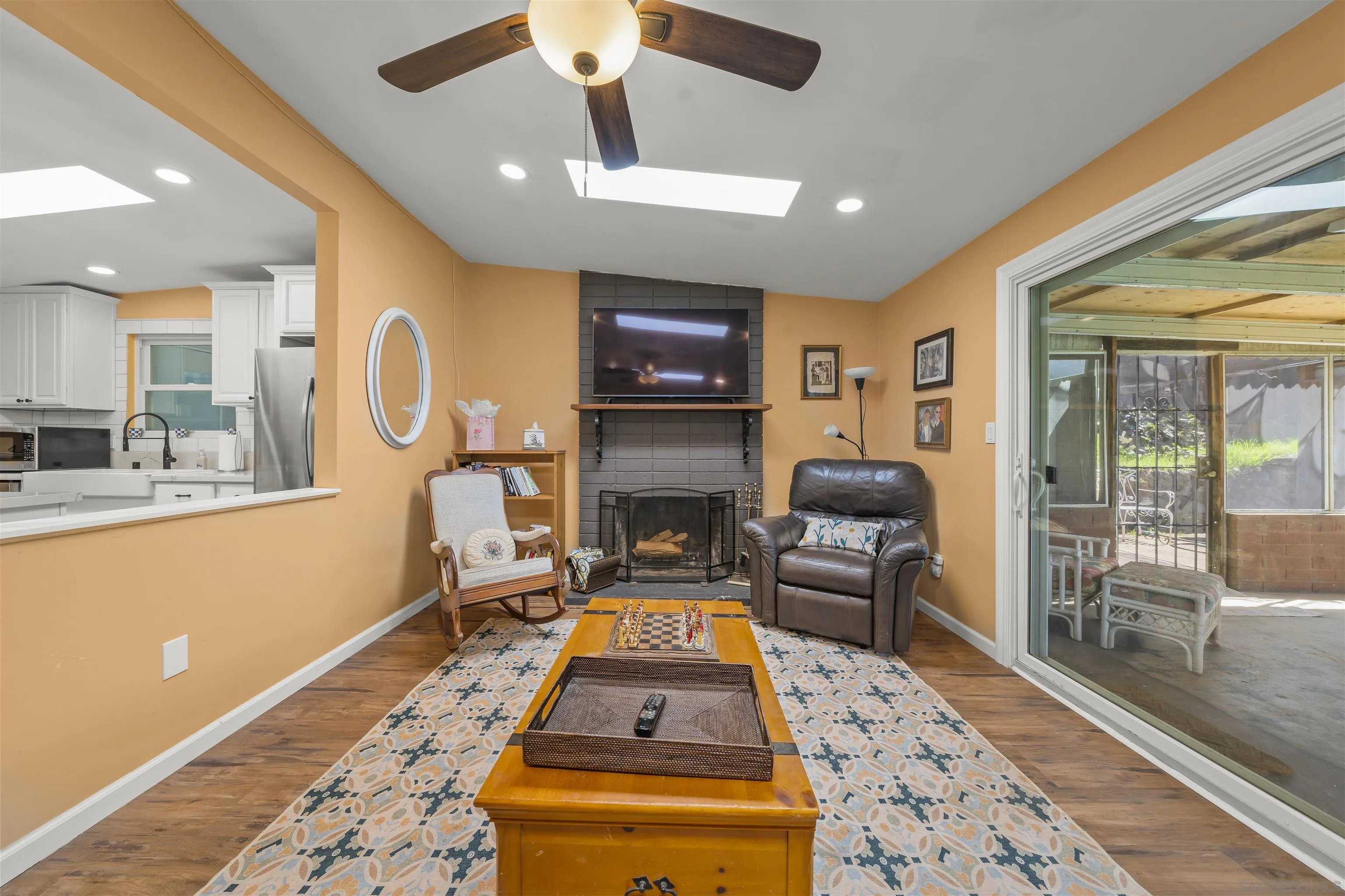 9240 Northcote Road Santee, CA 92071 - Photo 12 of 45 a living room with furniture and a fireplace