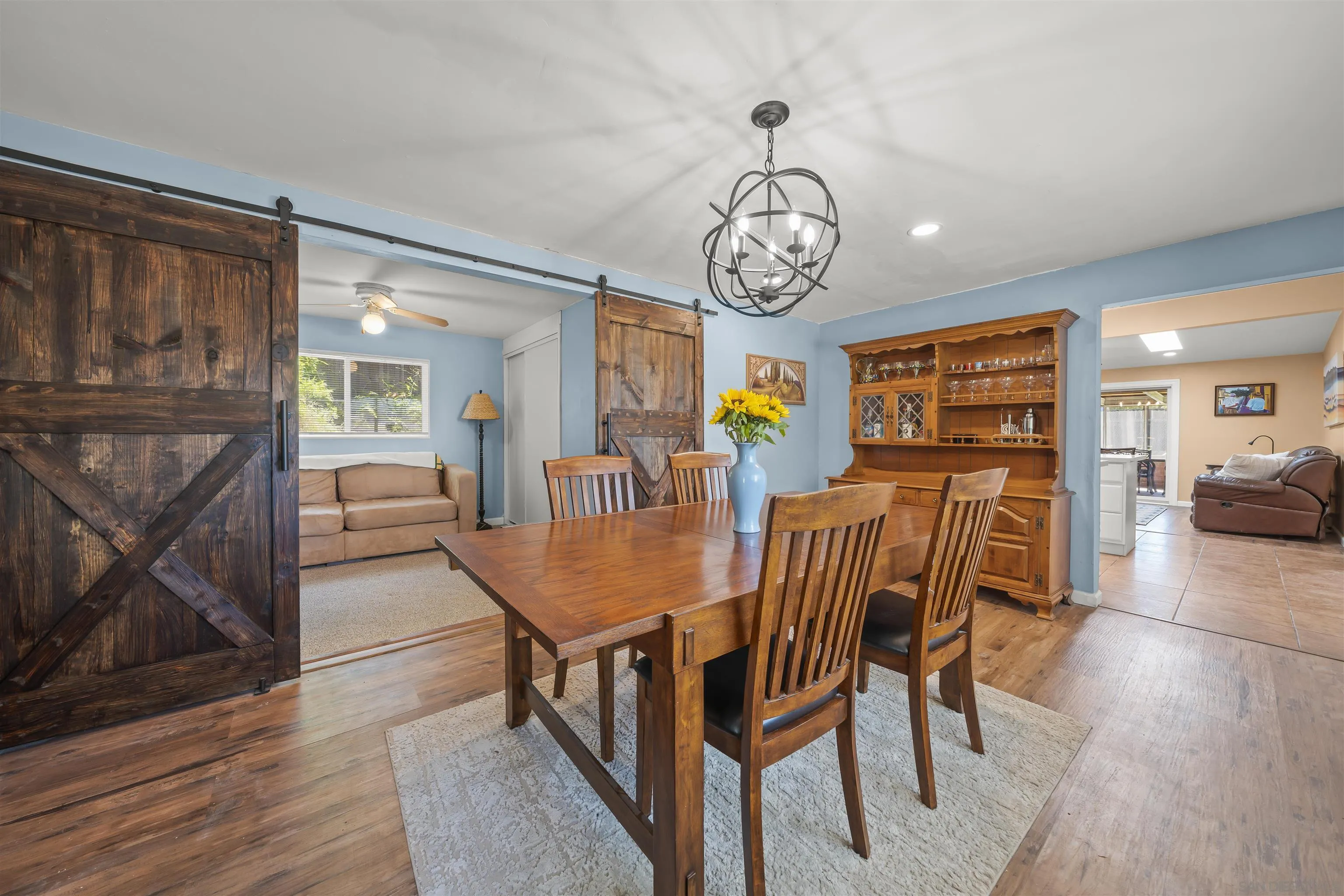 9240 Northcote Road Santee, CA 92071 - Photo 13 of 45 a view of a dining room with furniture window and wooden floor