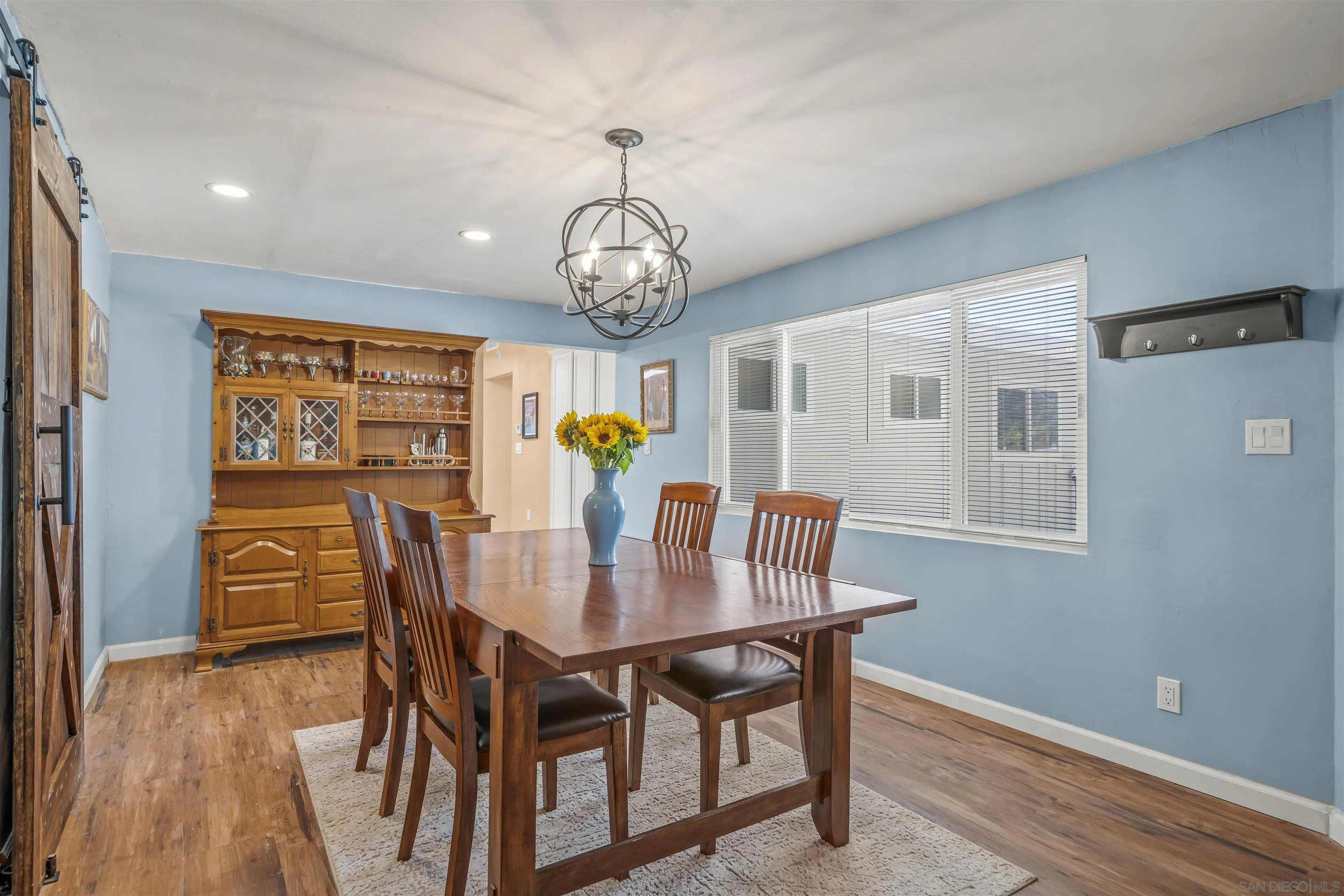 9240 Northcote Road Santee, CA 92071 - Photo 15 of 45 a view of a dining room with furniture window and wooden floor