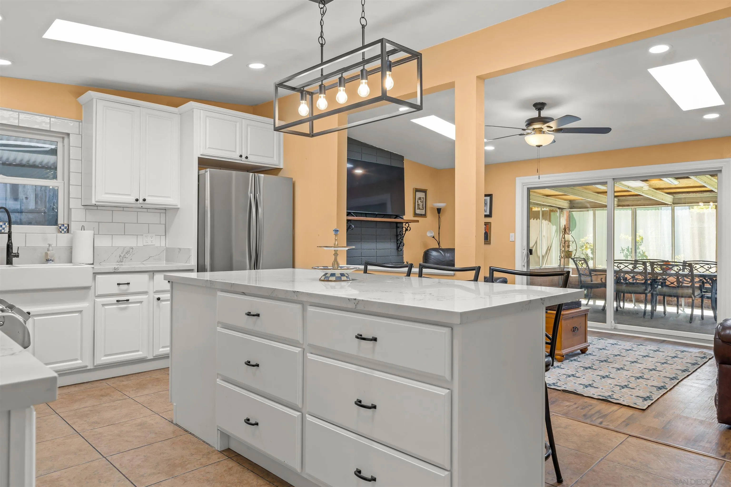 9240 Northcote Road Santee, CA 92071 - Photo 2 of 45 a kitchen with a sink stove and cabinets