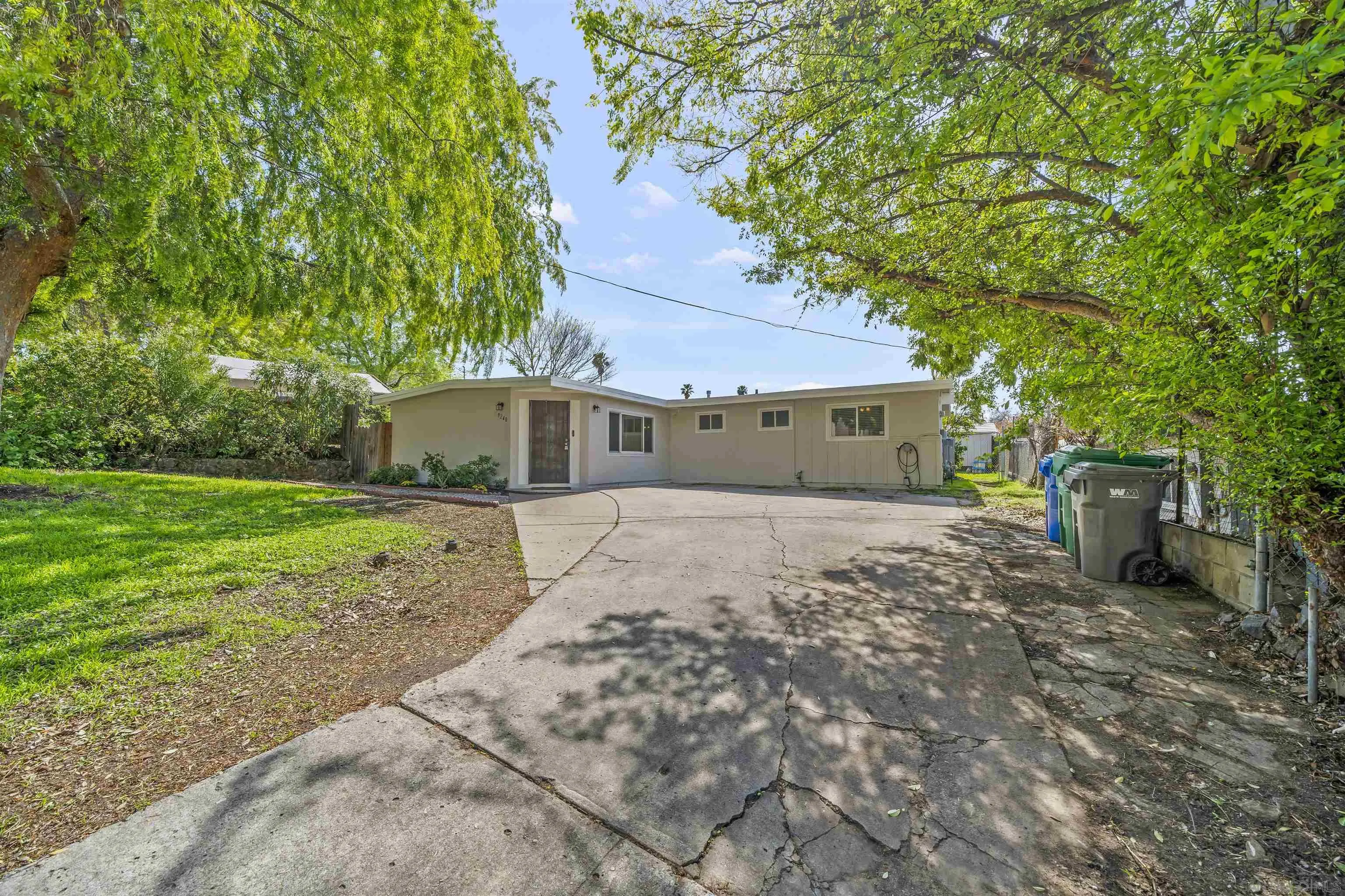 9240 Northcote Road Santee, CA 92071 - Photo 23 of 45 a front view of a house with garden