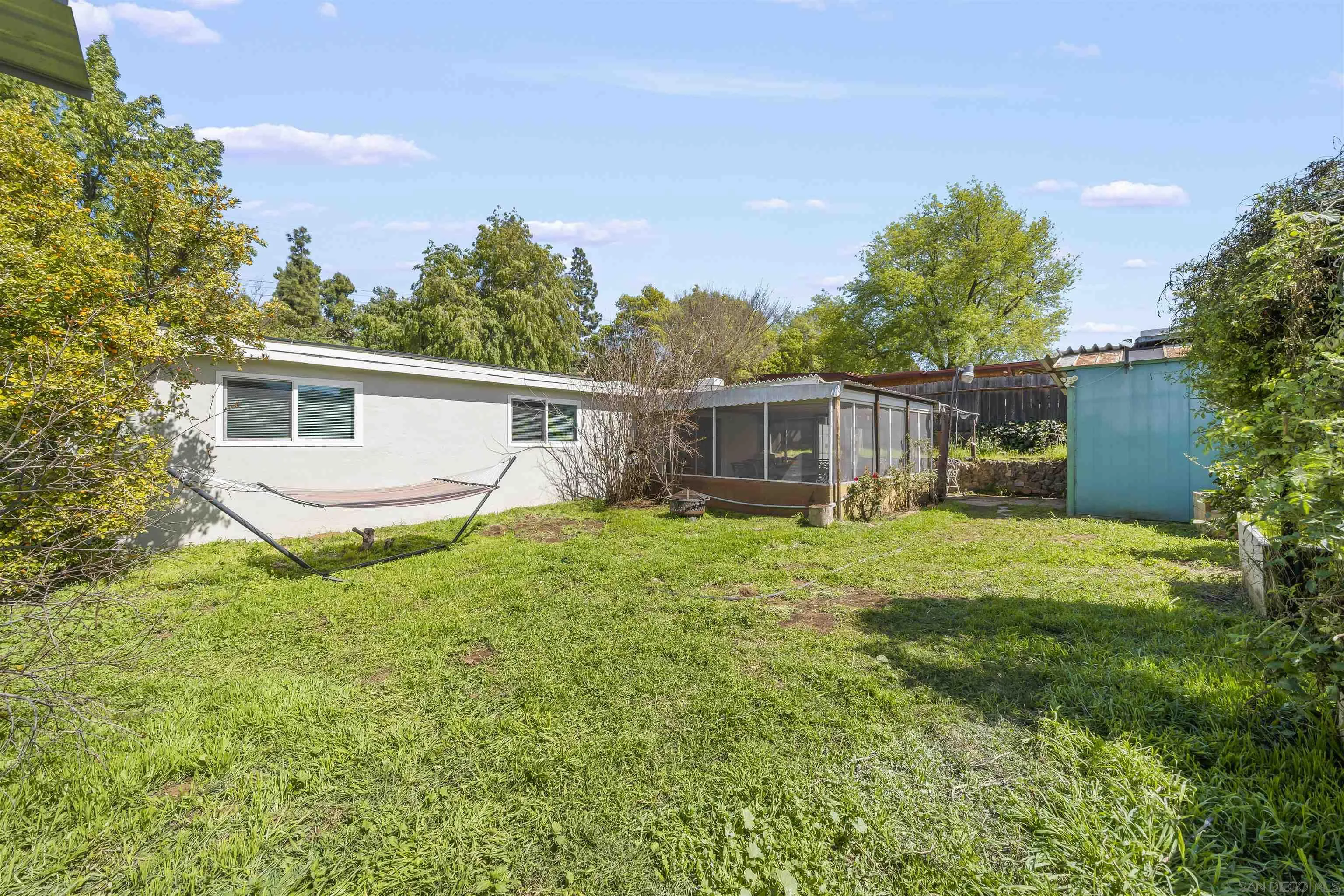 9240 Northcote Road Santee, CA 92071 - Photo 31 of 45 a view of a house with backyard and a garden