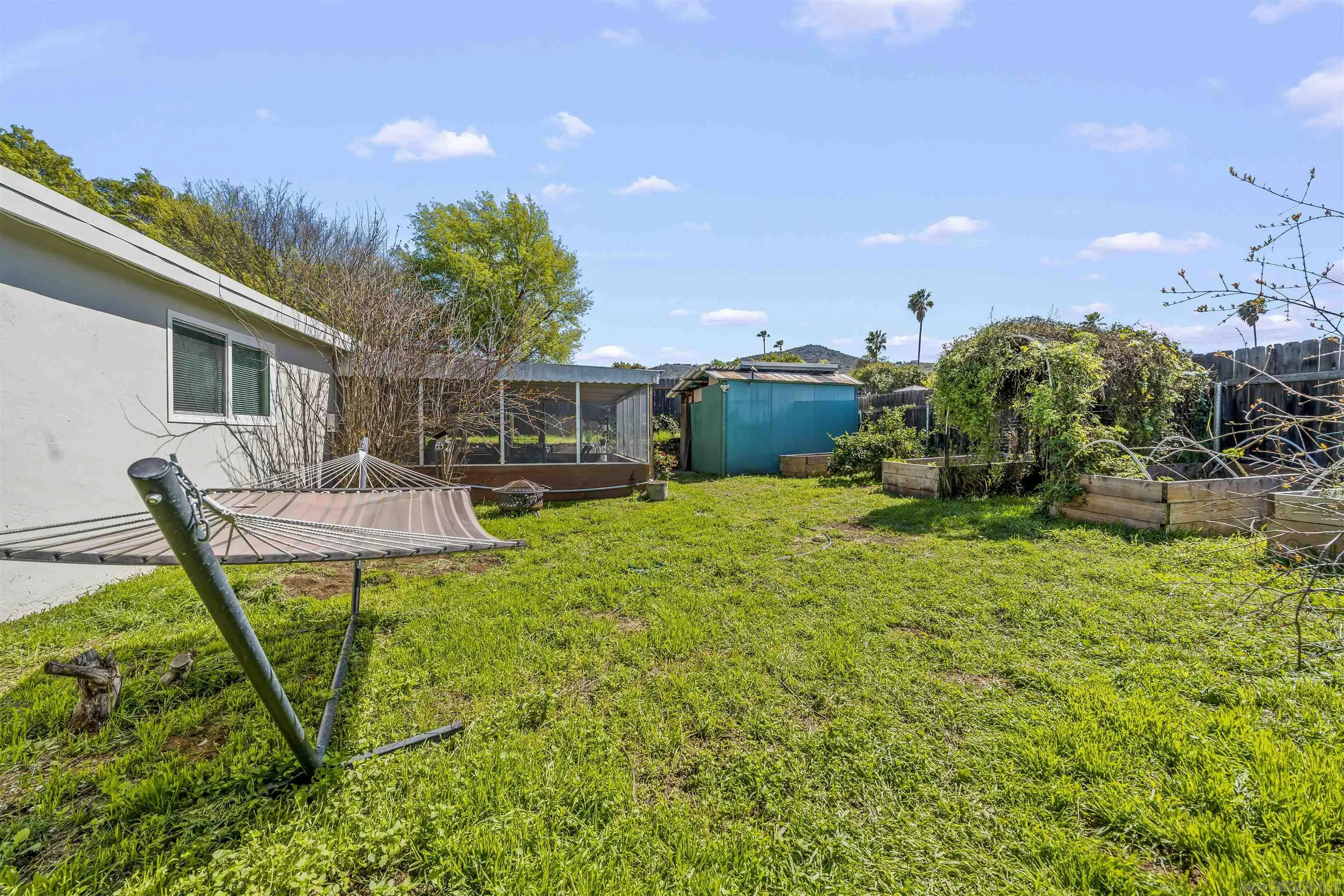 9240 Northcote Road Santee, CA 92071 - Photo 32 of 45 a view of a house with backyard and sitting area