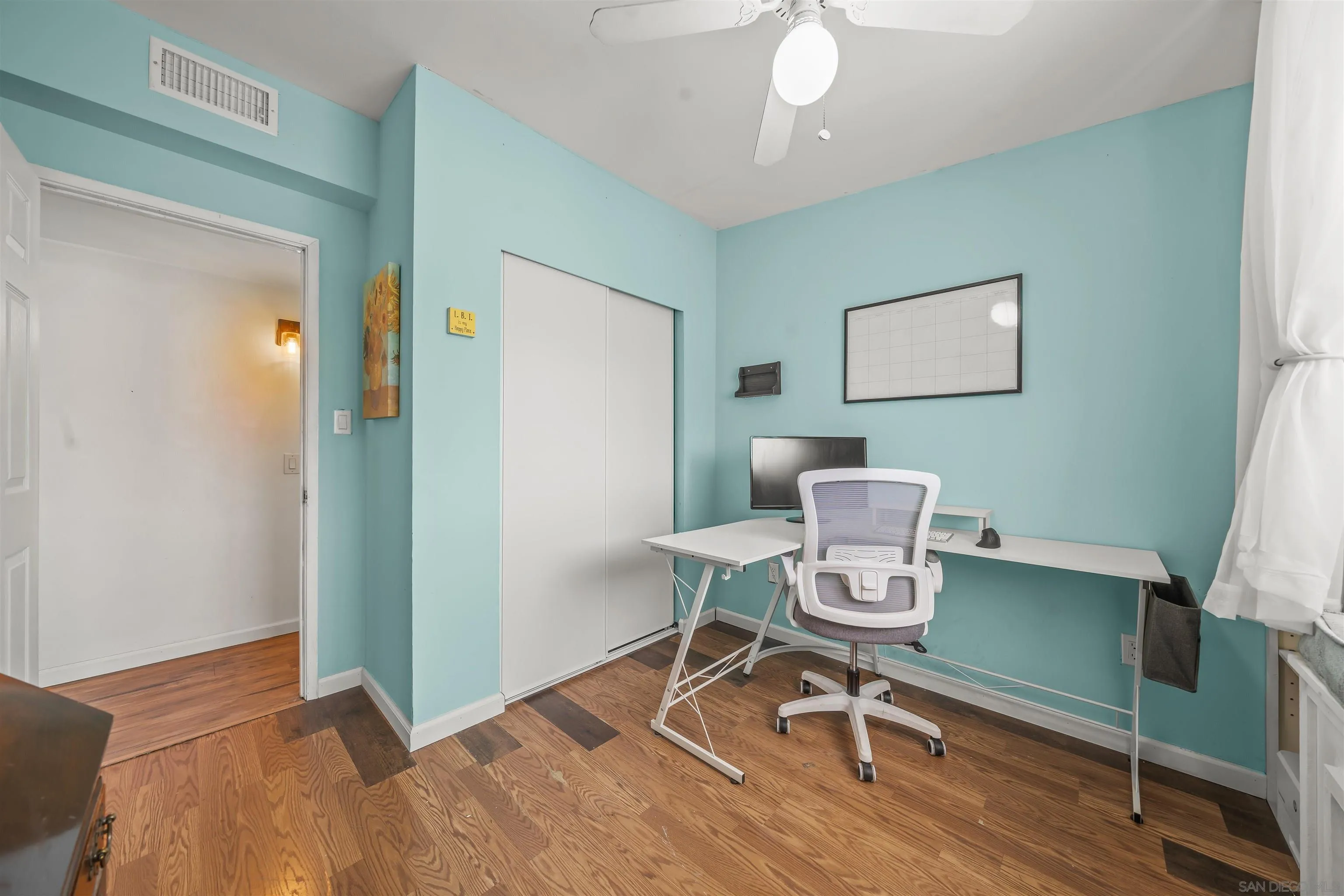 9240 Northcote Road Santee, CA 92071 - Photo 40 of 45 a workspace with furniture and wooden floor