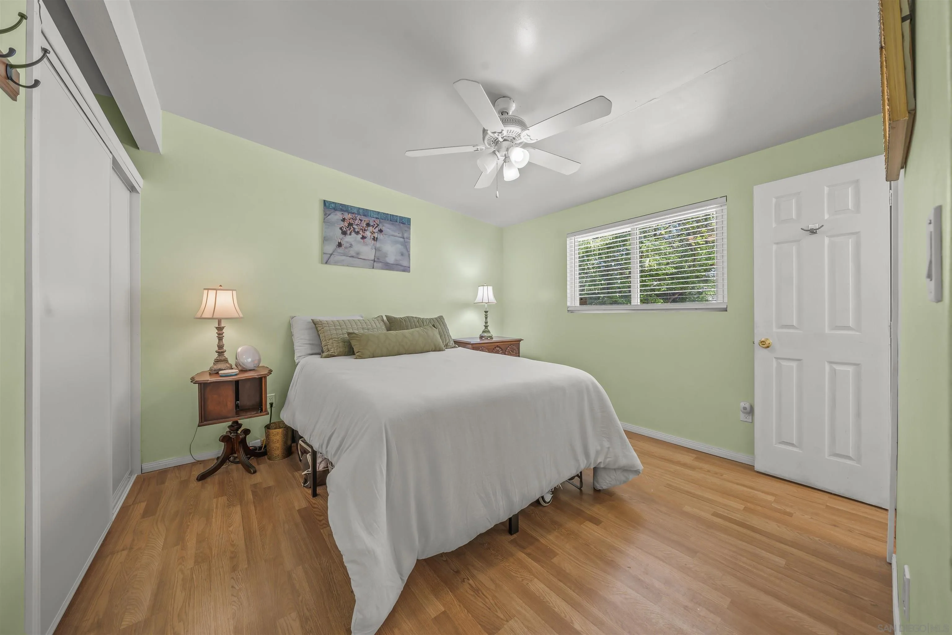 9240 Northcote Road Santee, CA 92071 - Photo 42 of 45 a bedroom with a bed and a chandelier