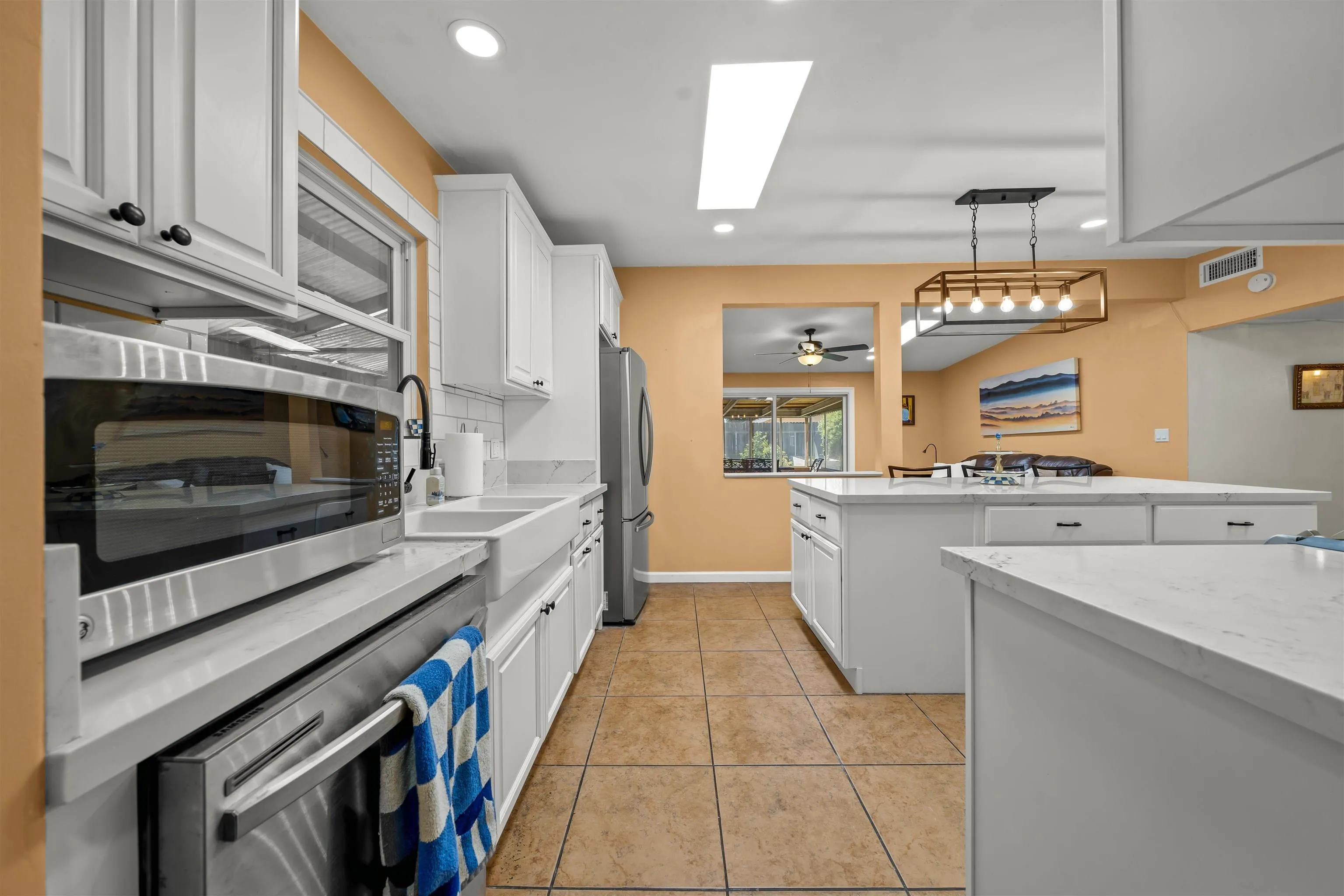 9240 Northcote Road Santee, CA 92071 - Photo 43 of 45 a kitchen with a stove and a microwave