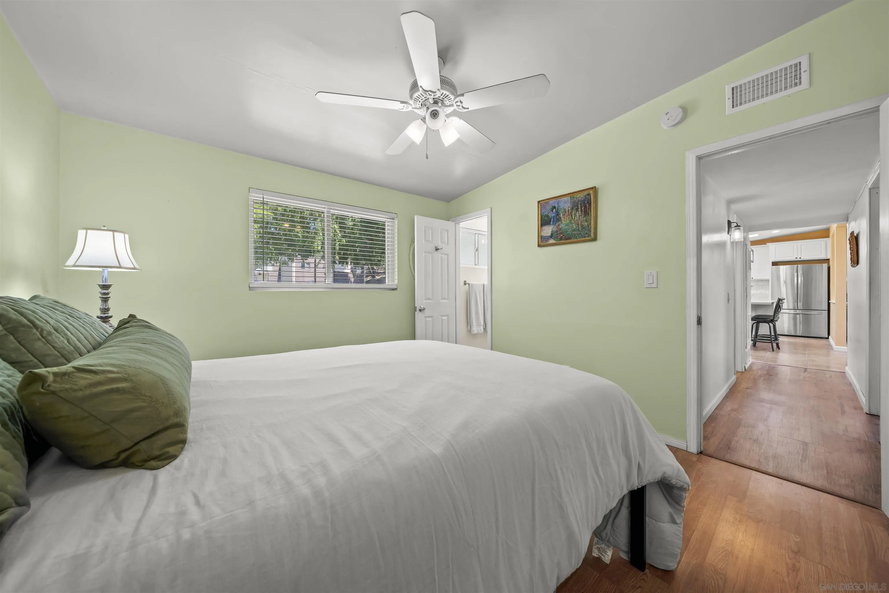 9240 Northcote Road Santee, CA 92071 - Photo 44 of 45 a bedroom with a bed and a chandelier