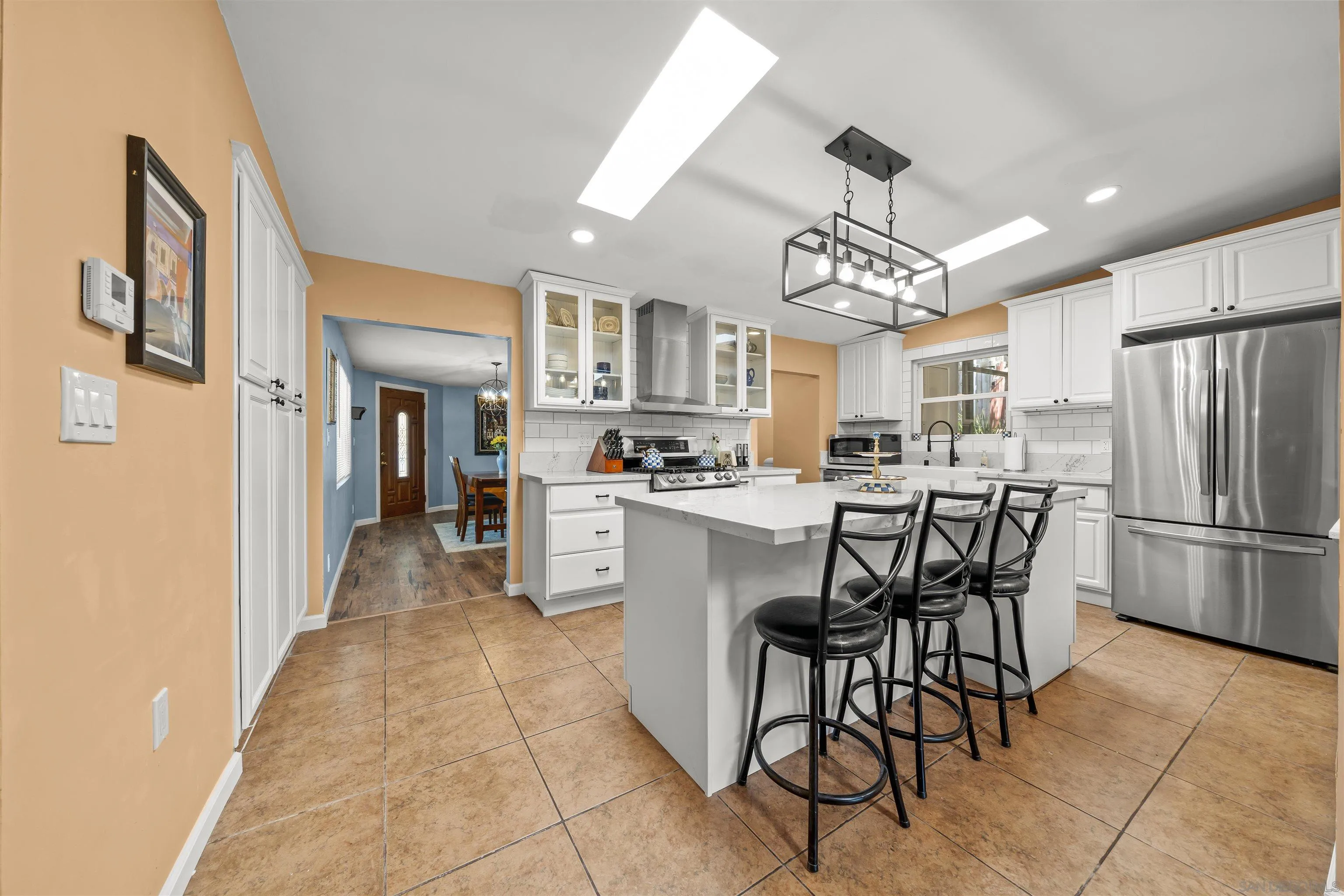 9240 Northcote Road Santee, CA 92071 - Photo 7 of 45 a kitchen with refrigerator and cabinets