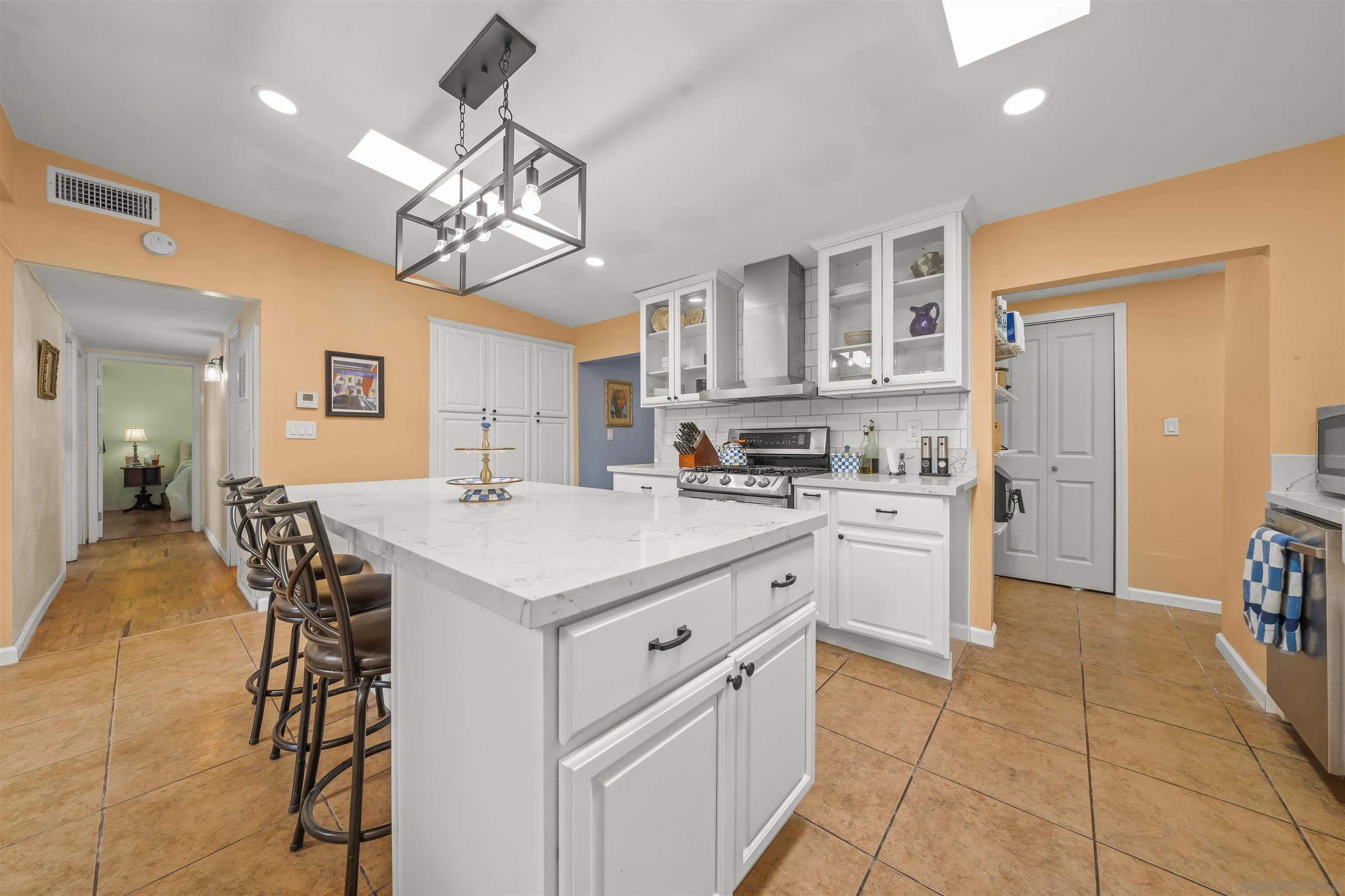 9240 Northcote Road Santee, CA 92071 - Photo 9 of 45 a kitchen with cabinets and chairs