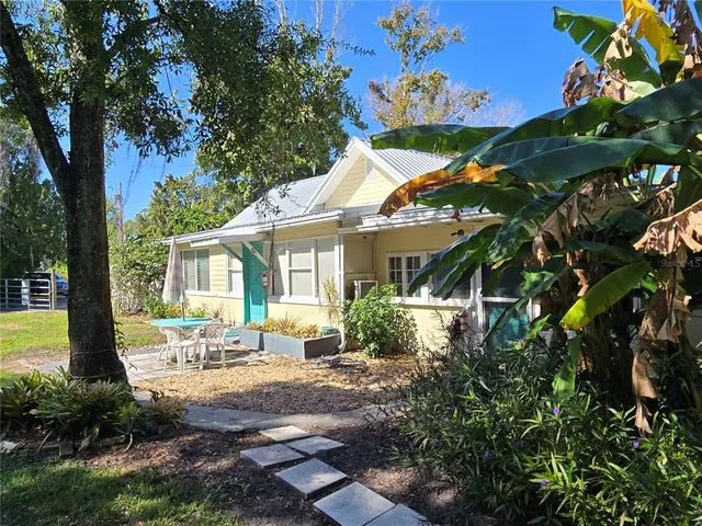 a house with a tree in front of it