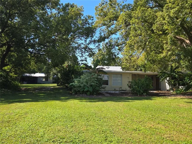 a view of outdoor space with deck and yard