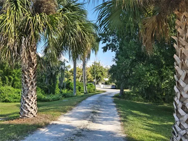 a front view of a house with garden and patio