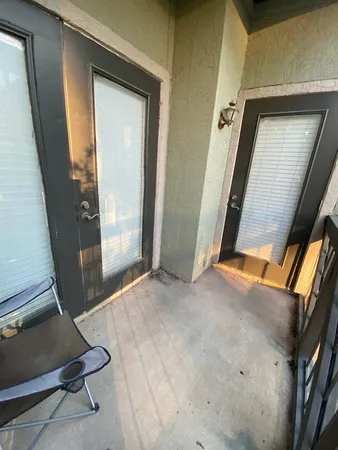 a bedroom with double bed and a window