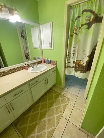 a bathroom with a toilet and a bathtub