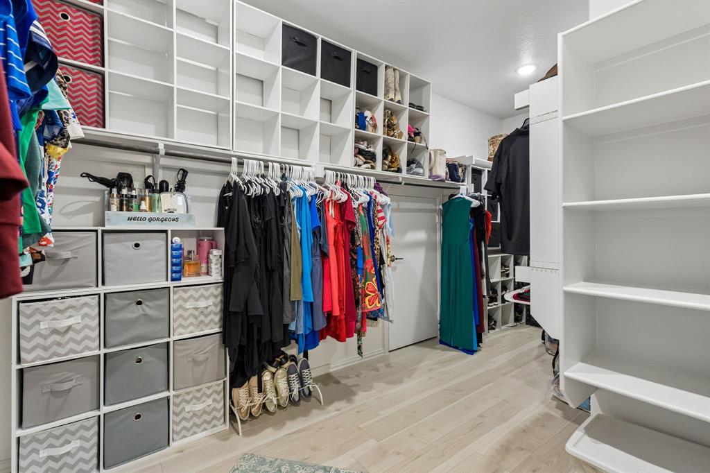 1023 Ridgehurst Road Melissa, TX 75454 - Photo 22 of 39 Custom closet system featuring extensive shelving, hanging rods, and built-in cubbies