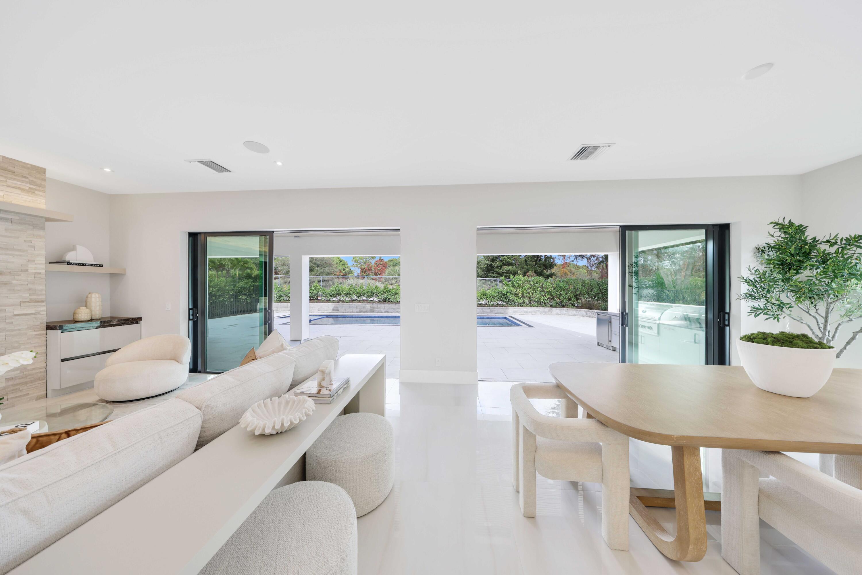 151 Eden Ridge Lane Boynton Beach, FL 33435 - Photo 13 of 74 a living room with furniture and a potted plant