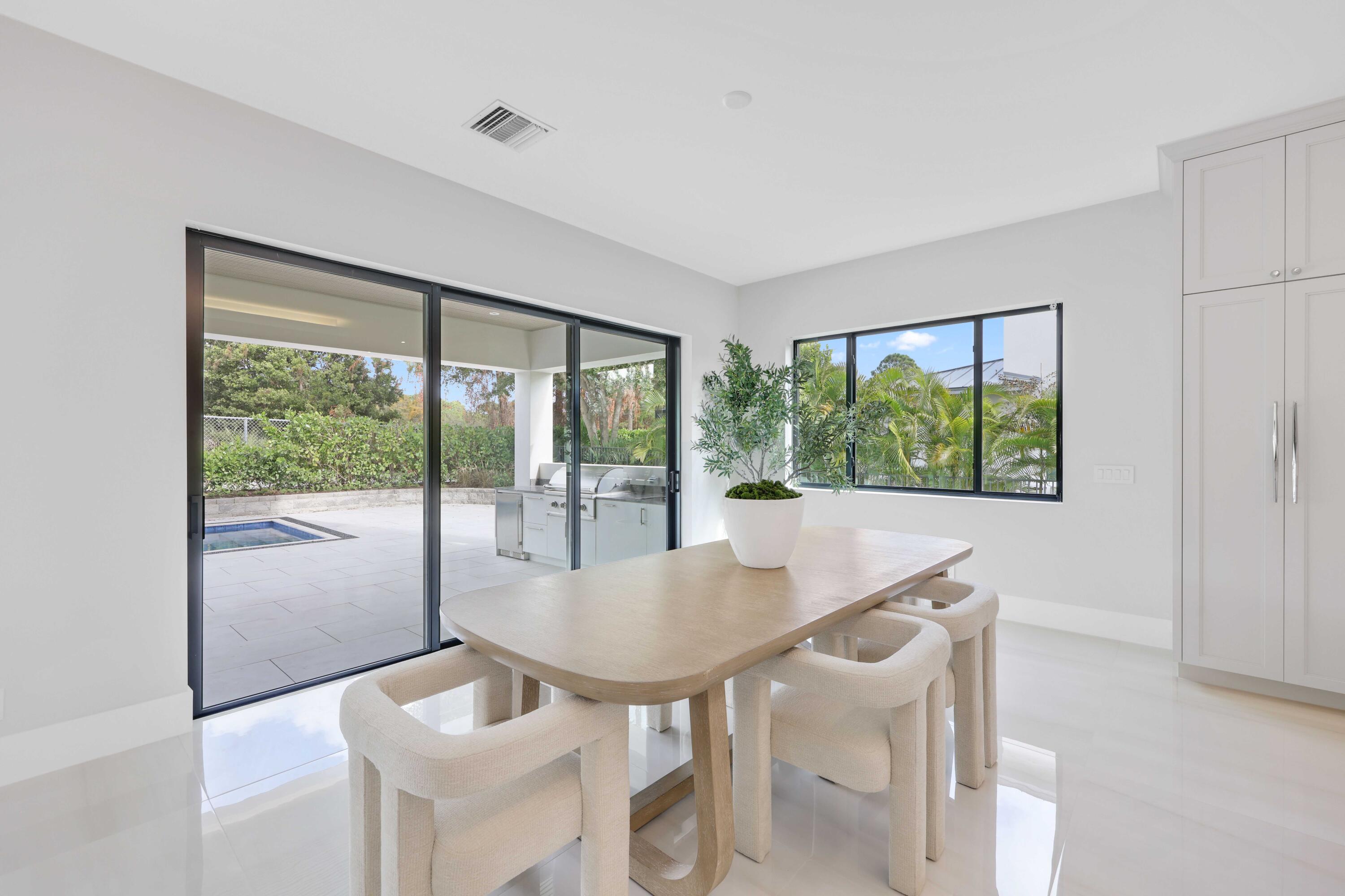 151 Eden Ridge Lane Boynton Beach, FL 33435 - Photo 15 of 74 a view of a dining room with furniture window and outside view