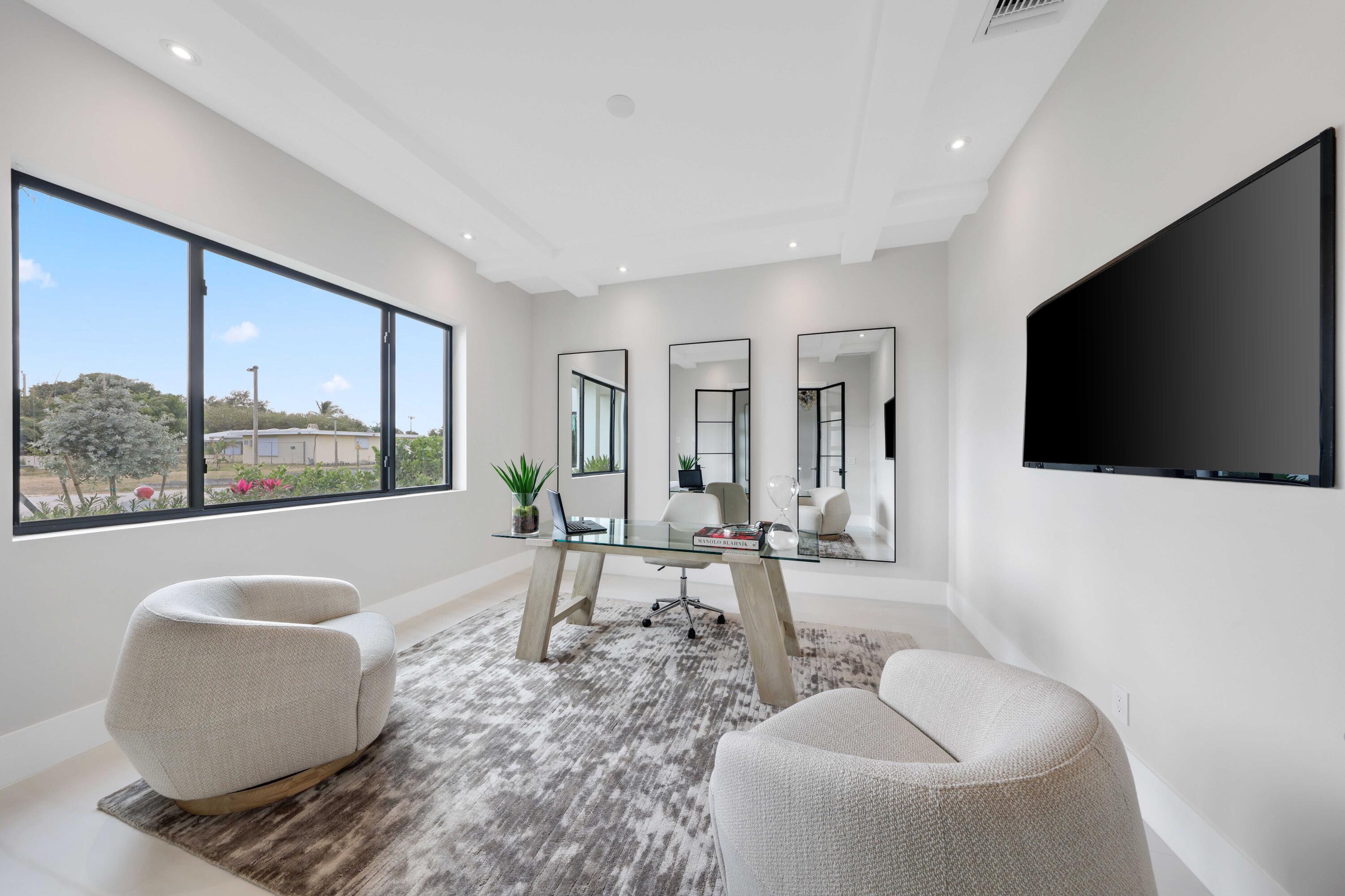 151 Eden Ridge Lane Boynton Beach, FL 33435 - Photo 29 of 74 a living room with furniture and a flat screen tv