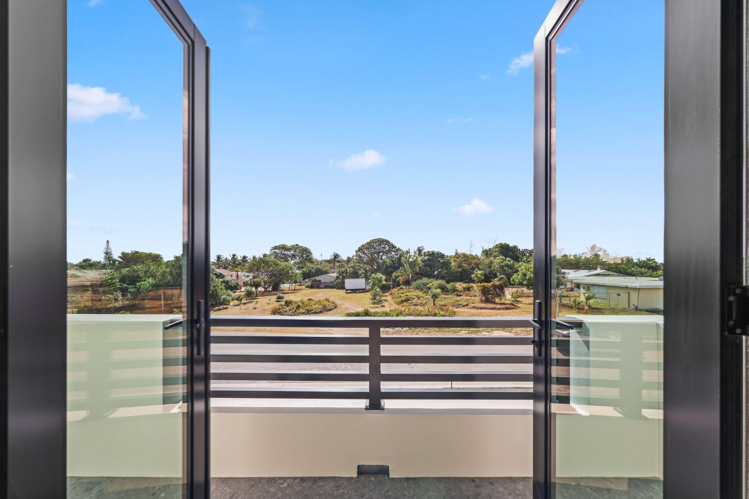 151 Eden Ridge Lane Boynton Beach, FL 33435 - Photo 42 of 74 a view of a balcony next to a yard