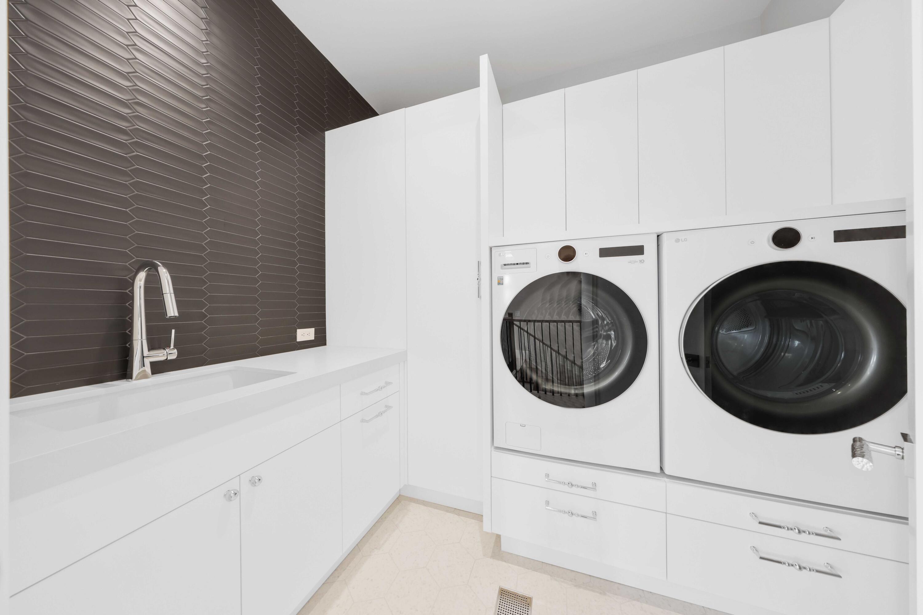 151 Eden Ridge Lane Boynton Beach, FL 33435 - Photo 50 of 74 a utility room with dryer and washer