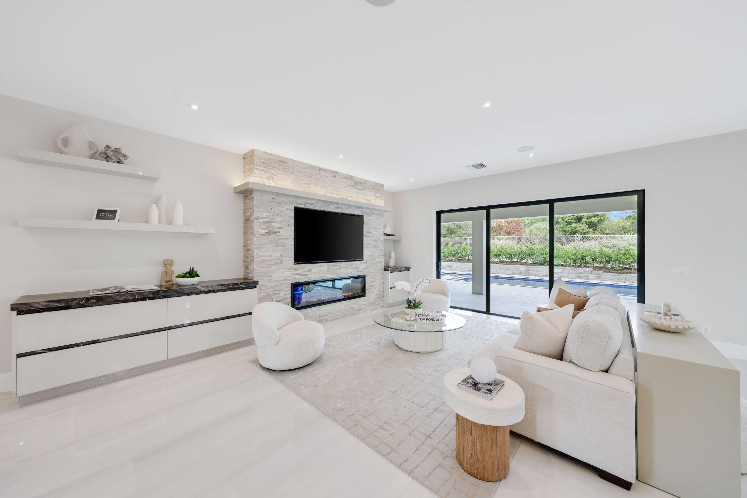 151 Eden Ridge Lane Boynton Beach, FL 33435 - Photo 10 of 74 a living room with furniture and a flat screen tv