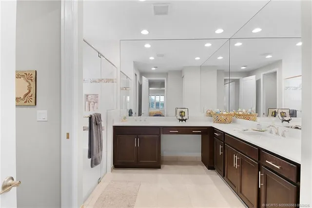 a large kitchen with a sink and dishwasher