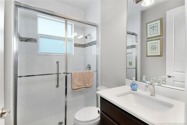 a bathroom with a sink toilet and vanity