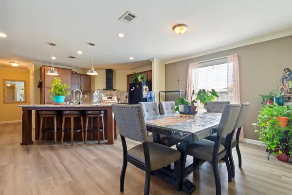 a dining room with furniture and window