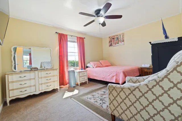 a bedroom with a bed and a dresser