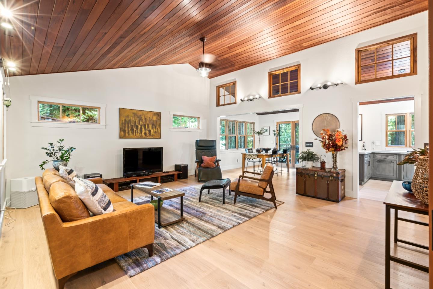 126 Filbert Road Woodside, CA 94062 - Photo 11 of 61 a living room with fireplace furniture and a potted plant