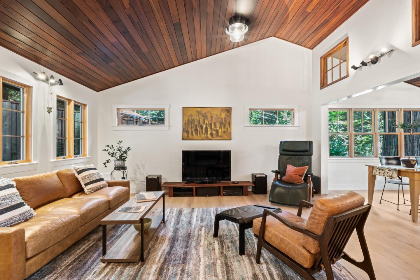 126 Filbert Road Woodside, CA 94062 - Photo 13 of 61 a living room with furniture a flat screen tv and a fireplace