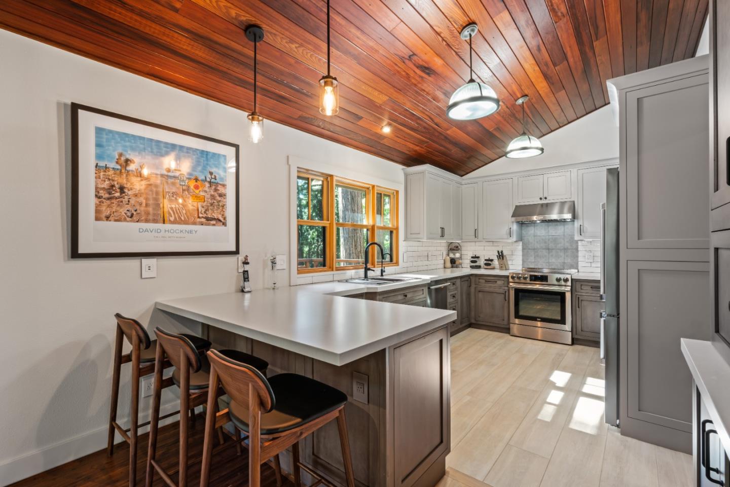 126 Filbert Road Woodside, CA 94062 - Photo 20 of 61 a dinning table and chairs in a kitchen