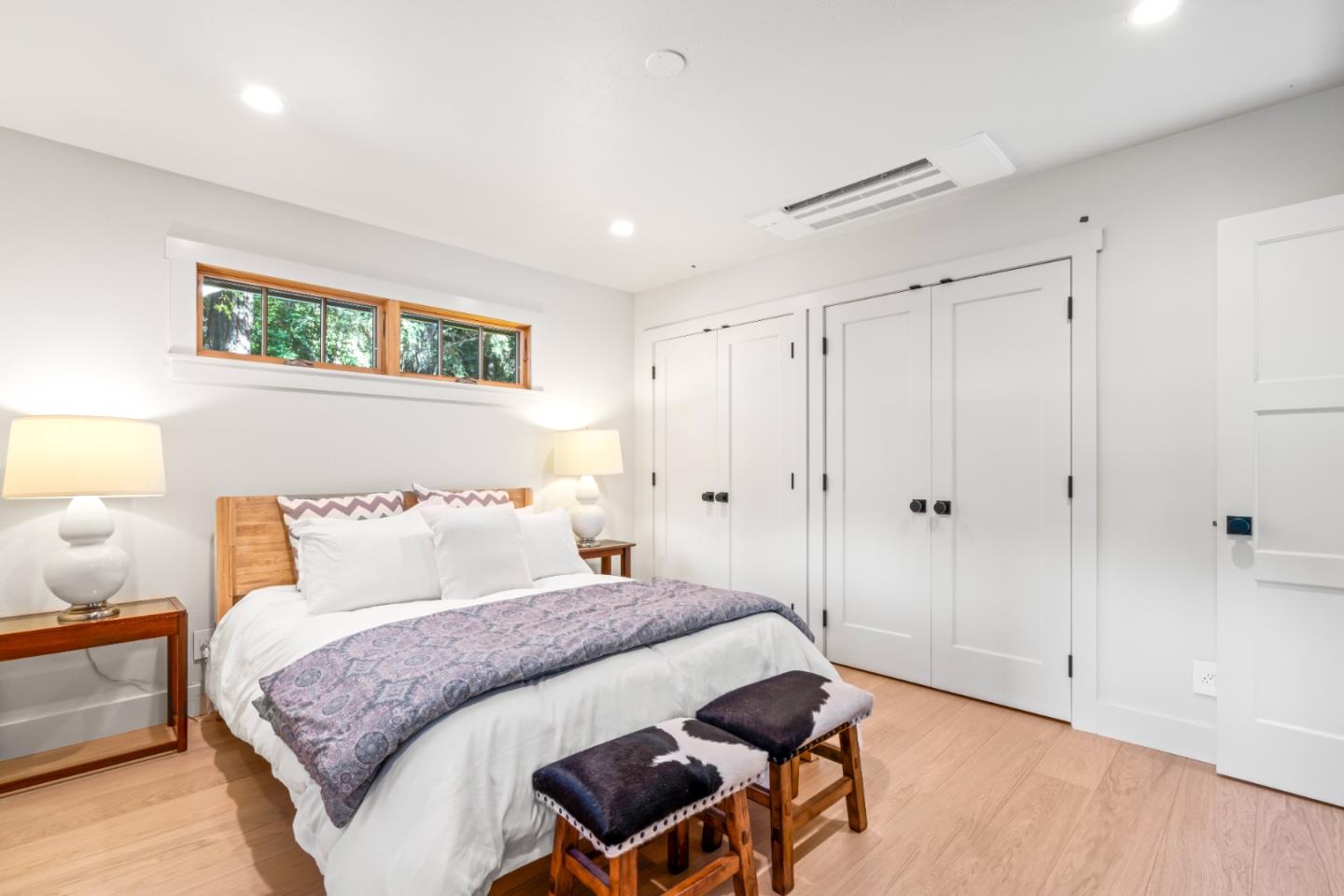 126 Filbert Road Woodside, CA 94062 - Photo 34 of 61 a bedroom with a bed and a lamp