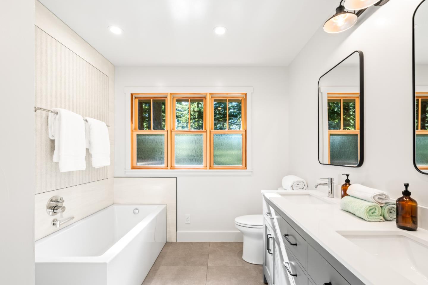 126 Filbert Road Woodside, CA 94062 - Photo 35 of 61 a bathroom with a tub sink and mirror