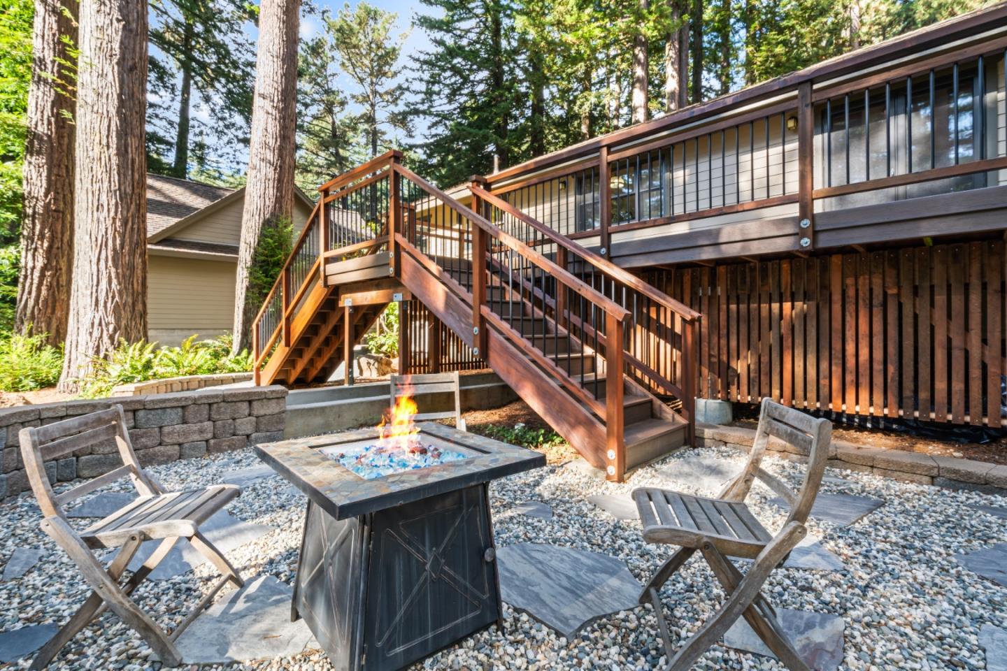 126 Filbert Road Woodside, CA 94062 - Photo 44 of 61 a backyard of a house with table and chairs