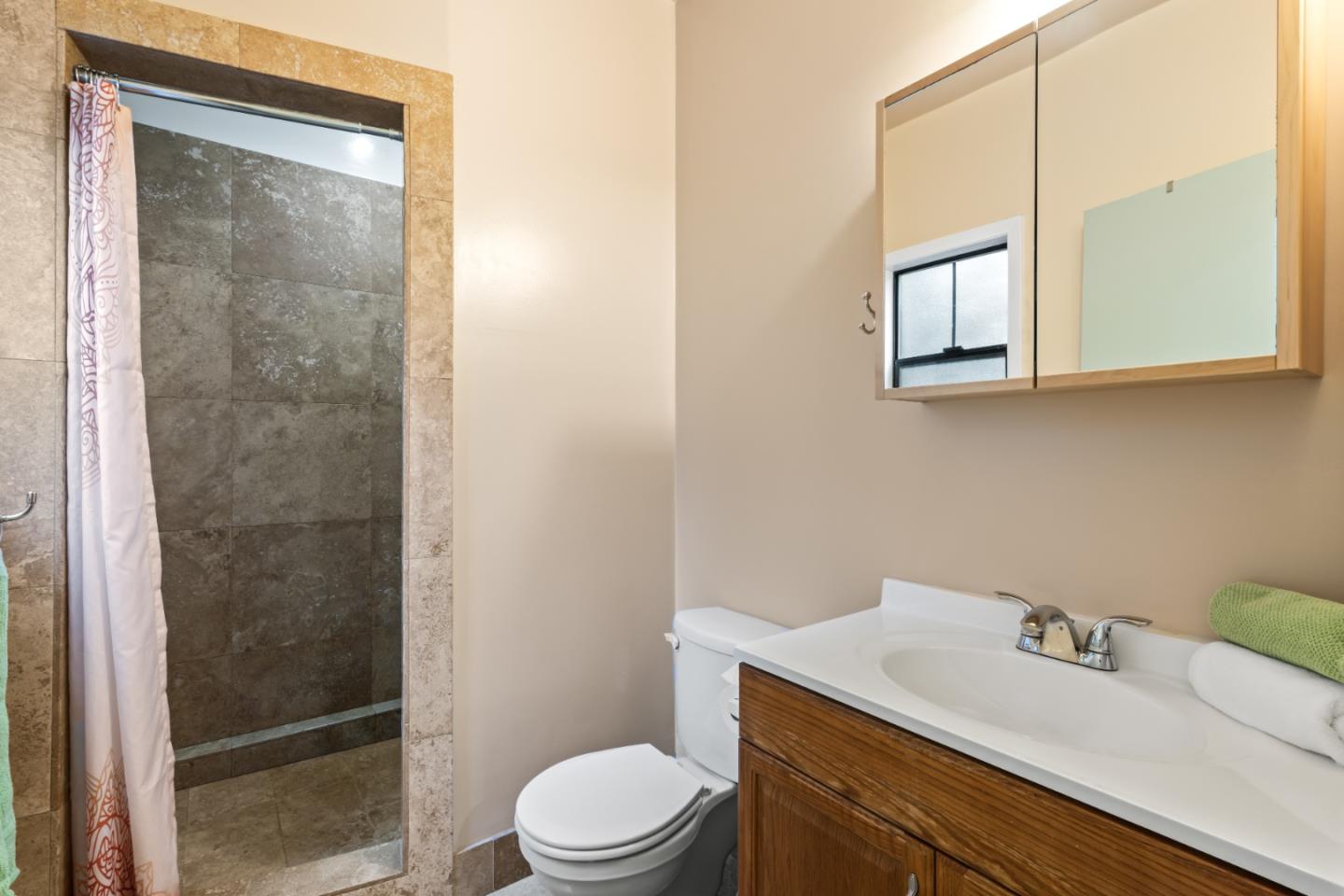 126 Filbert Road Woodside, CA 94062 - Photo 58 of 61 a bathroom with a granite countertop sink mirror vanity and toilet