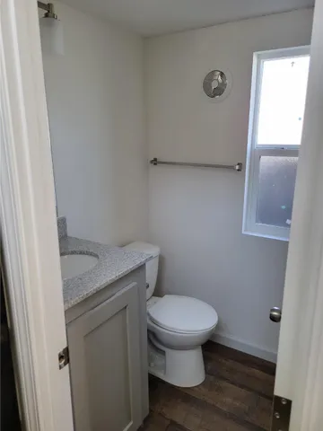 a bathroom with a toilet and a sink