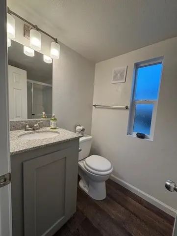 a bathroom with a glass shower door