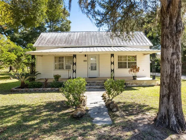 a view of house with yard