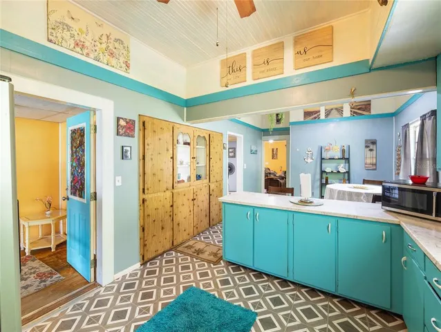 a view of a house with a large tree