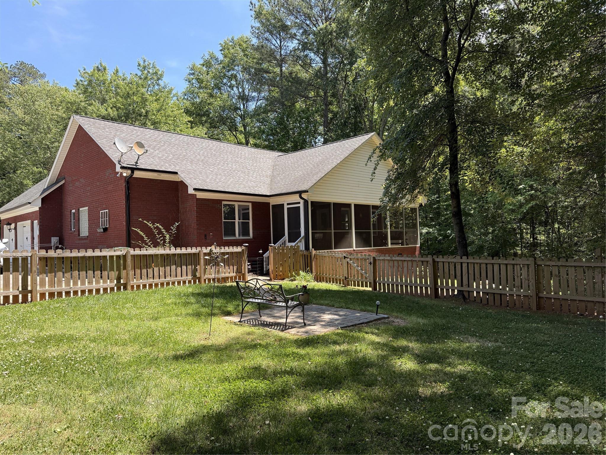 145 Upper Spencer Mountain Road Stanley, NC 28164 - Photo 28 of 29 a house view with a sitting space and garden