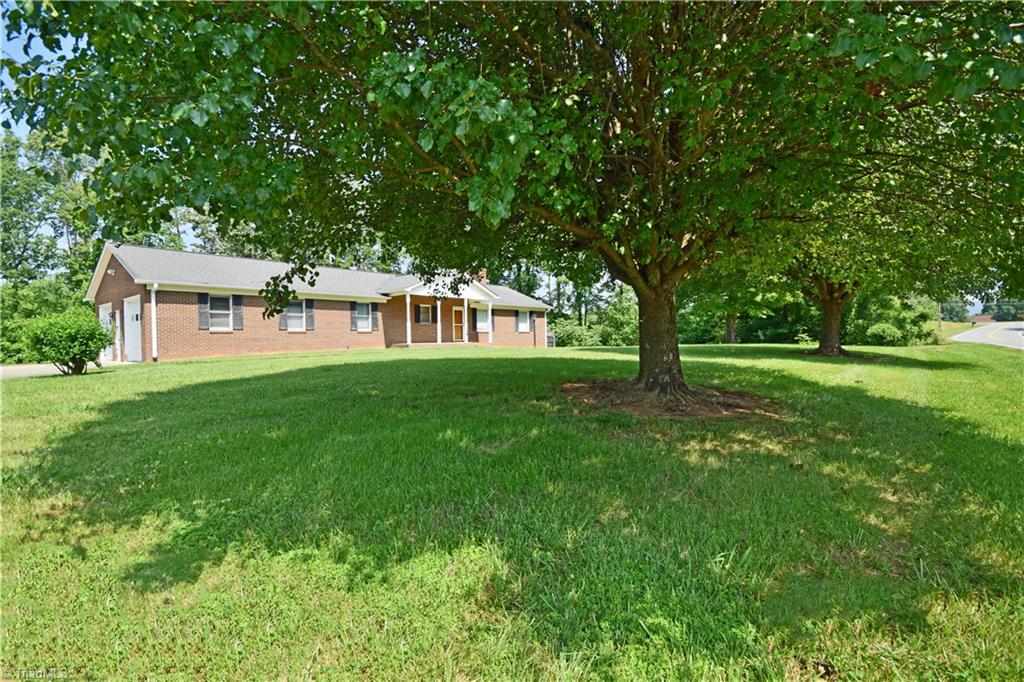 1058 Priddy Road King, NC 27021 - Photo 2 of 29 mature trees in beautiful front yard