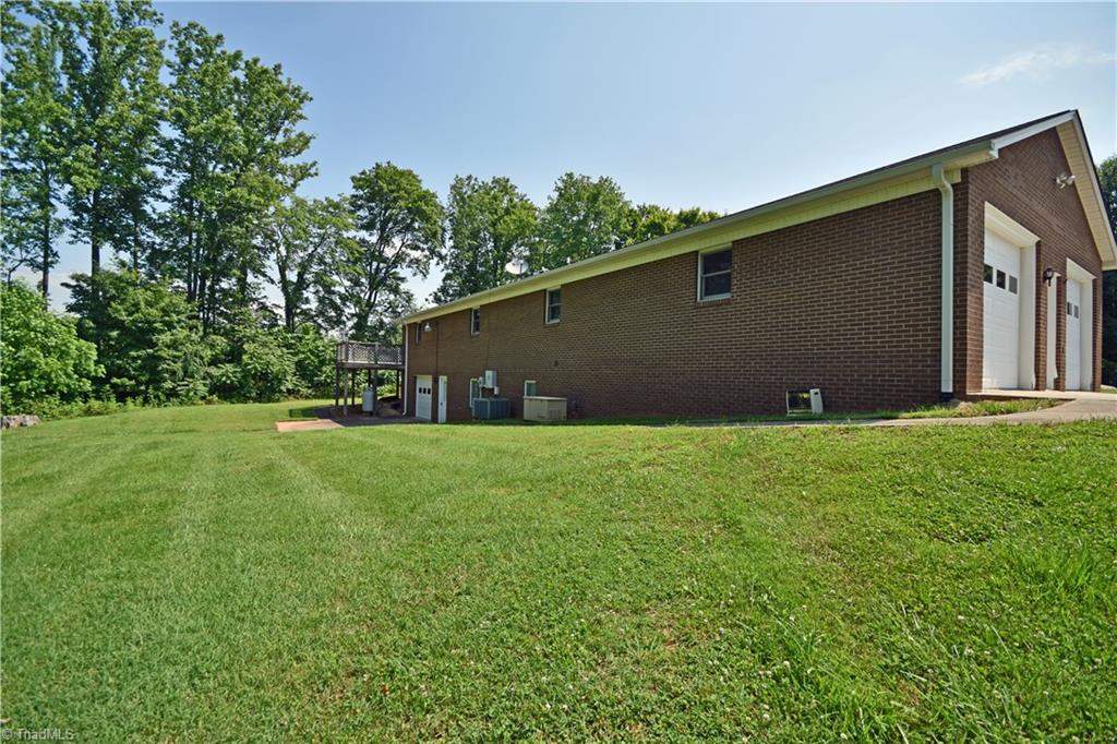 1058 Priddy Road King, NC 27021 - Photo 24 of 29 back features deck, patio & propane generator