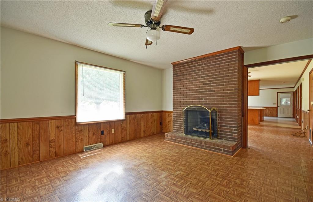 1058 Priddy Road King, NC 27021 - Photo 9 of 29 Den just off master with brick fireplace and gas logs