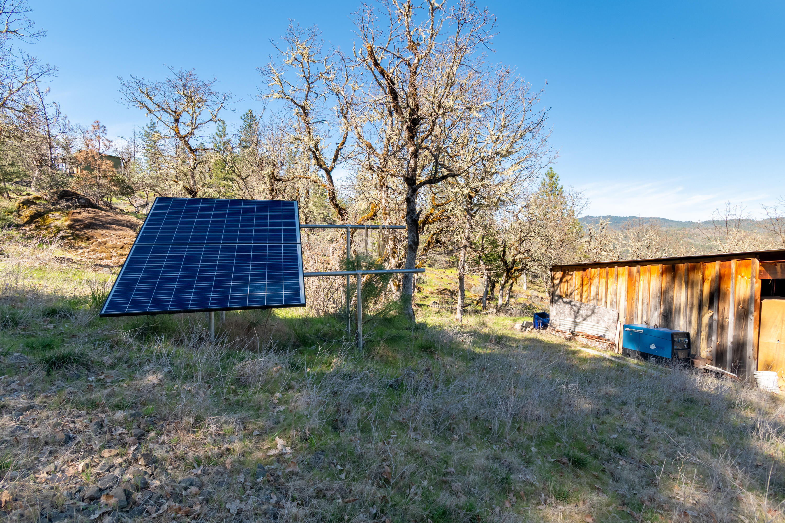 300 Citadel Road Trail, OR 97541 - Photo 10 of 25 a backyard of a house with lots of green space