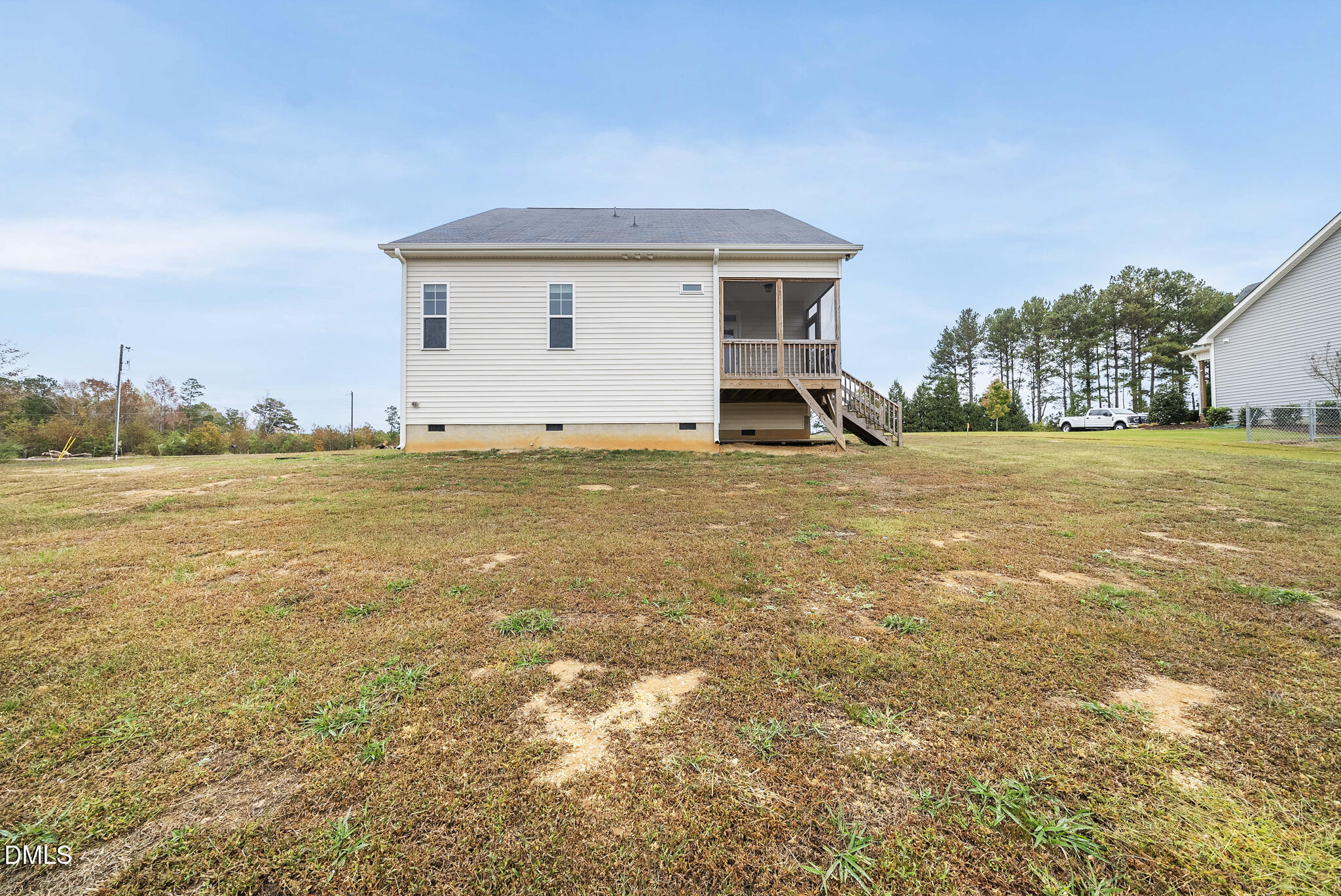 1177 Mudham Road Wendell, NC 27591 - Photo 29 of 30 a view of a house with a yard and a large tree