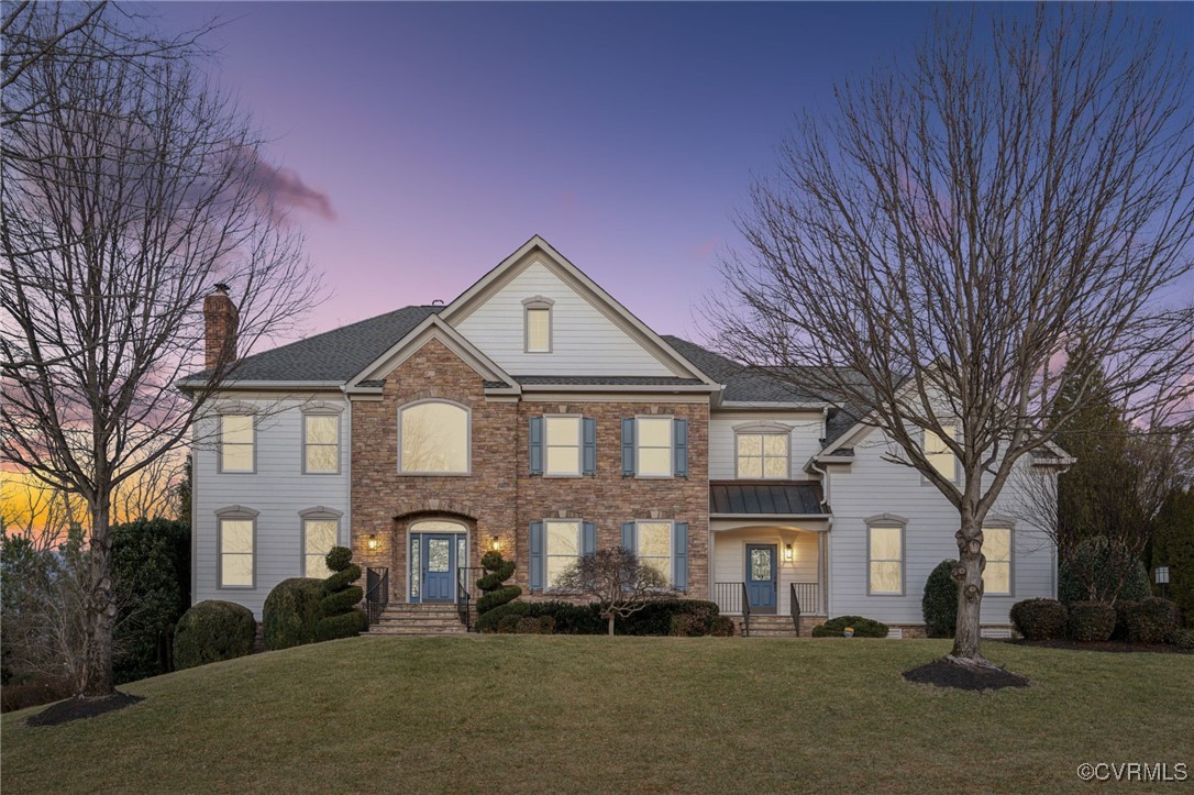 a front view of a house with a yard