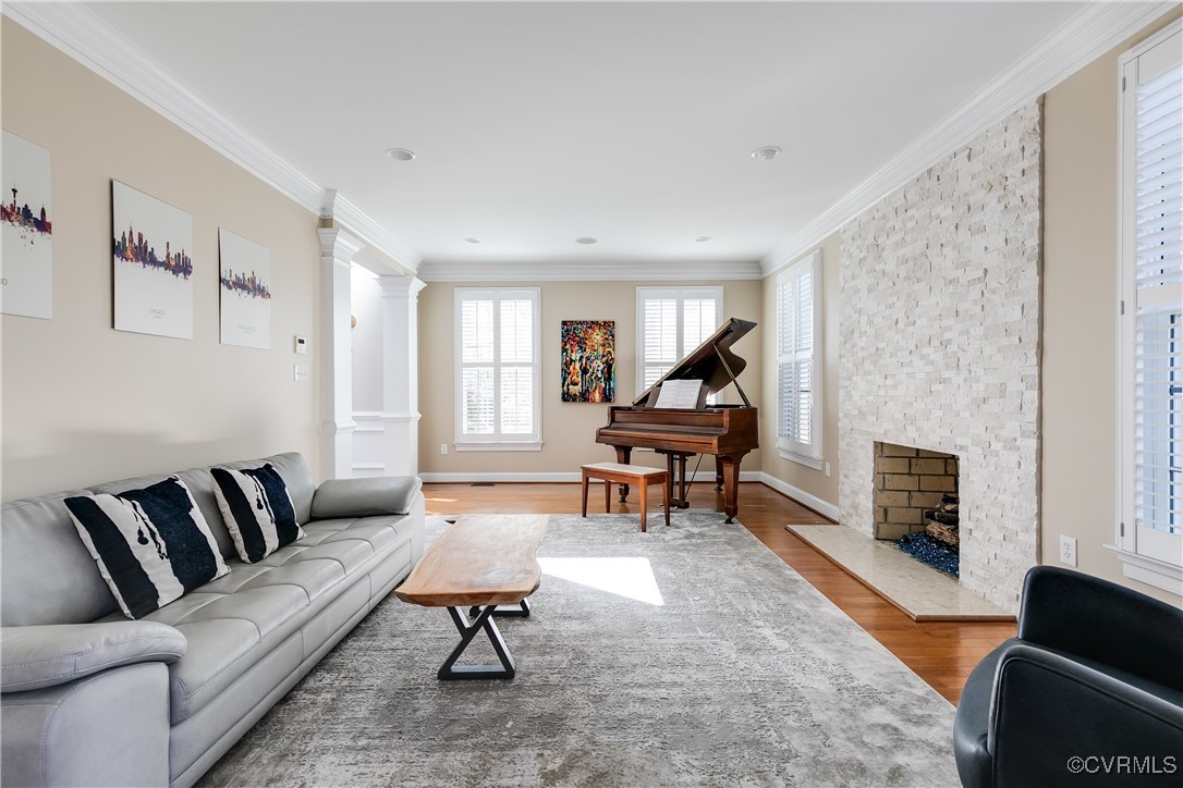 521 Raleigh Manor Road Henrico, VA 23229 - Photo 11 of 46 a living room with furniture a fireplace and a flat screen tv